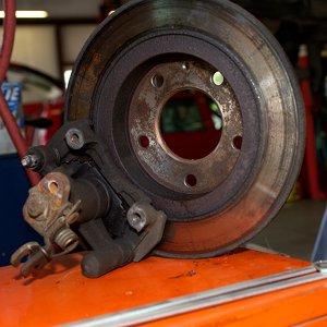 Brake caliper seized onto brake rotor due to lack of rear brake maintenance Southampton NY